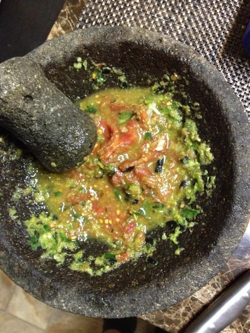 The traditional way of making salsa is using the molcajete (mortar and pestle) to crush the tomatoes and peppers together.