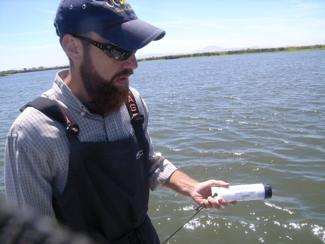 John Miskella holds a dissolved oxygen / temperature datasonde for use in the study.