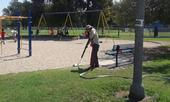 Weed steaming near playground