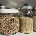 Grains stored in glass jars to prevent pantry pest infestations. Photo by Karey Windbiel-Rojas, UC IPM.