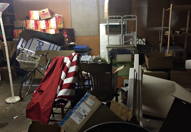 This cluttered garage has many hiding spaces for pests. [A. Schellman]