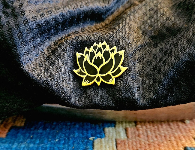 Lotus flower pin on hat - P. Pashby