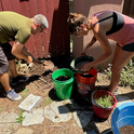 Gardeners sorting compost