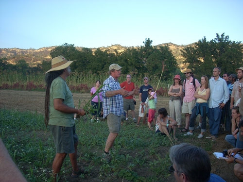 Paul Muller and Amego Bob lead a farm tour