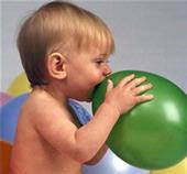 Baby with balloons.