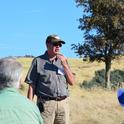 Ken Tate speaks at a rangeland field day.