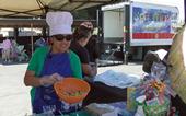 UCCE nutrition educator Grilda Gomez provides nutrition education at FoodLink of Tulare County fresh produce giveaway in Farmersville.