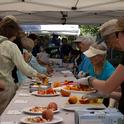 Visitors taste a variety of stone fruit at the UC Cooperative Extension Harvest Day.