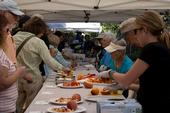 Visitors taste a variety of stone fruit at the UC Cooperative Extension Harvest Day.