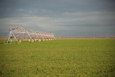 Overhead irrigation systems can be part of an agricultural system that improves irrigation management, increases carbon storage and builds soil quality.