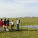 Students gather near a vernal pool on the nature preserve on the UC Merced campus.