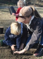 Volunteers plant trees.