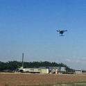 A drone takes a test run over a field at the UC Kearney Research and Extension Center.