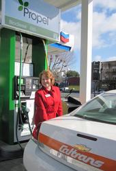 USDA's Judith Canales fuels a CalTrans vehicle that runs on biofuel.