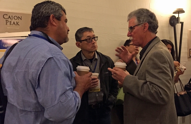 From left, Ramiro Lobo and Loren Oki talk with Mike Mellano, PAC member and one of California's delegates to the APLU Council on Agricultural Research, Extension and Teaching.