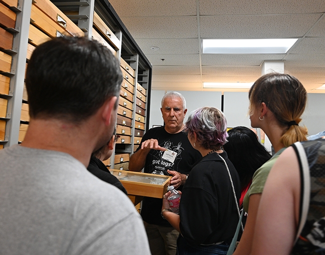 Entomologist Jeff Smith, curator of the Bohart Museum's Lepidoptera collection, talks to visitors. (Photo by Kathy Keatley Garvey)