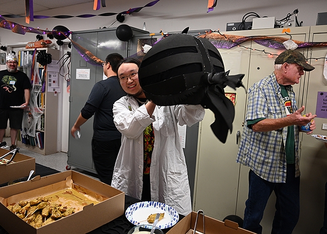 Allen Chew's self-created horse fly costume drew lots of praise. Also pictured  are (far left) arachnologist-geneticist Jim Starrett, and (far right) Dick Meyer, a UC Davis doctoral alumnus who retired from a medical entomology career. (Photo by Kathy Keatley Garvey)