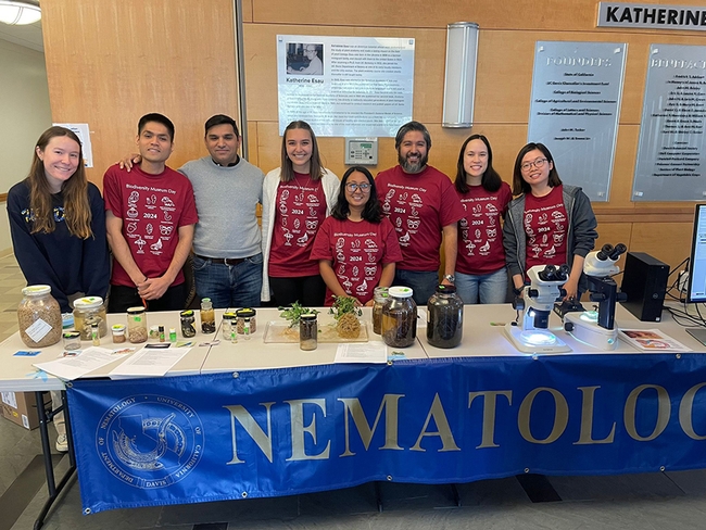 Ready to greet the crowds are (from left) Emma Kraft, undergraduate intern; Nick Latina, doctoral student, Plant Pathology; Shahid Siddique, associate professor and principal investigator; Alison Blundell, doctoral candidate, Plant Pathology; Pallavi Shakya, doctoral candidate, Plant Pathology; Bardo Castro, postdoctoral fellow; Veronica Casey, doctoral student, Entomology; and Ching-Jung Lin, doctoral candidate, Plant Pathology. (Photo courtesy of the Siddique lab)