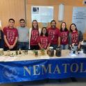 Ready to greet the crowds are (from left) Emma Kraft, undergraduate intern; Nick Latina, doctoral student, Plant Pathology; Shahid Siddique, associate professor and principal investigator; Alison Blundell, doctoral candidate, Plant Pathology; Pallavi Shakya, doctoral candidate, Plant Pathology; Bardo Castro, postdoctoral fellow; Veronica Casey, doctoral student, Entomology; and Ching-Jung Lin, doctoral candidate, Plant Pathology. (Photo courtesy of the Siddique lab)