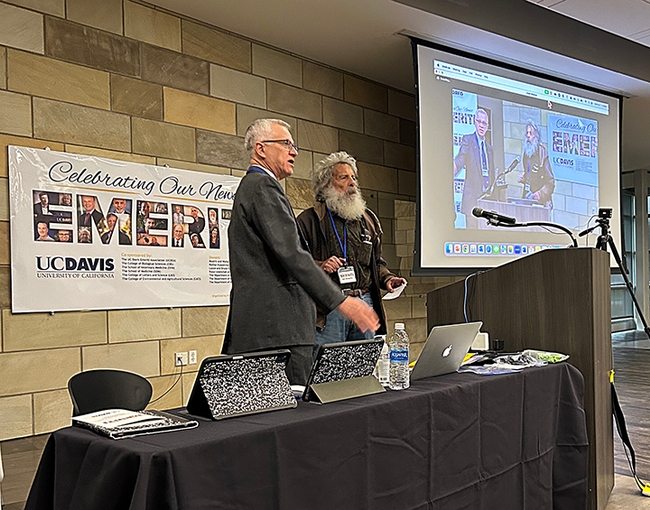 UC Davis distinguished professor Walter Leal (left), organizer and host of the emeriti celebrations, introduces UC Davis distinguished professor emeritus Art Shapiro, known as 