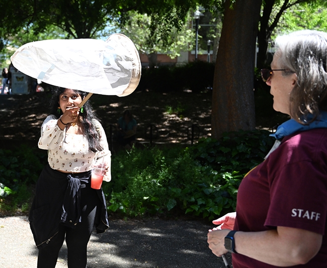 It's a catch! UC Davis undergraduate student Lasya Nalia, majoring in environmental horticulture, nets a paper butterfly tossed by Professor Fran Keller of Folsom Lake College, a Bohart Museum scientist and UC Davis doctoral alumna.  (Photo by Kathy Keatley Garvey)