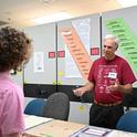 Bohart Museum associate Michael  Pitcairn, retired from the California Department of Food and Agriculture, answers questions about silkworm moths and textiles. (Photo by Kathy Keatley Garvey)