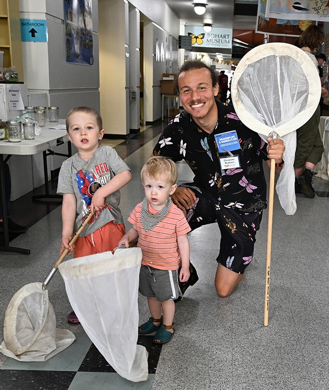 Future entomologists? The Nguyen brothers of Davis--Branden, 3, and Owen, 18 months old--pose with  UC Davis doctoral candidate Christofer Brothers. (Photo by Kathy Keatley Garvey)