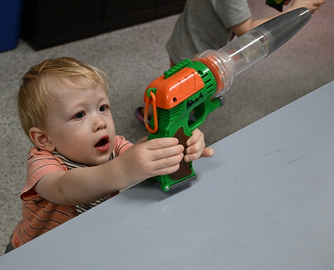 Owen Nguyen, 18 months old, looks at a bee vacuum at the Bohart Museum of Entomology open house. Scientists use these to capture, identify and release bees. (Photo by Kathy Keatley Garvey)