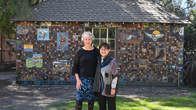 UC Davis distinguished professor emerita Diane Ullman of the Department of Entomology and Nematology and Gale Okumura, Department of Design faculty emerita, in front of 