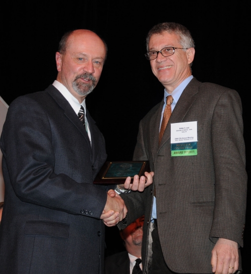 ESA AWARD--ESA President Michael Gray (left) presents the Recognition Award in Insect Physiology, Biochemistry and Toxicology to UC Davis chemical ecologist Walter Leal. (Photo by Kathy Keatley Garvey)