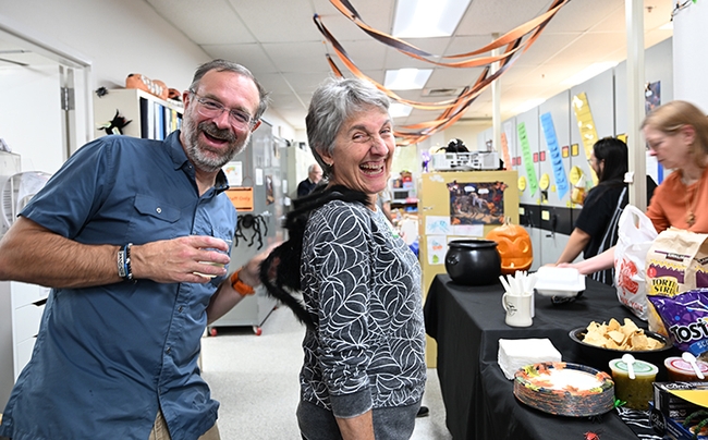 Professor Jason Bond, director of the Bohart Museum and UC Davis distinguished professor emerita Lynn Kimsey (dressed as a spider), former Bohart Museum director, share a laugh. Bond is an arachnologist and Kimsey, a hymenopterist. (Photo by Kathy Keatley Garvey)