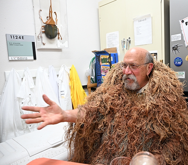 UC Davis retired faculty member Robert Kimsey, a forensic entomologist, wore his traditional ghillie suit as he served beverages. (Photo by Kathy Keatley Garvey)