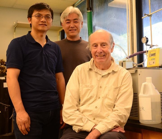 This archived image (2018) shows UC Davis distinguished professor Bruce Hammock (seated) with Hammock lab researcher Sung Hee Hwang (center) and former Hammock lab researcher Guodong Zhang, now on the UC Davis Department of Nutrition faculty. (Photo by Kathy Keatley Garvey)