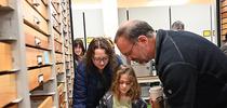 UC Davis professor Jason Bond, director of the Bohart Museum, shows butterfly specimens to Woodland residents Olive Smith, 8, and her mother Sarah Smith. Bond is the Evert and Marion Schlinger Endowed Chair, UC Davis Department of Entomology and Nematology, and associate dean, UC Davis College of Agricultural and Environmental Sciences. (Photo by Kathy Keatley Garvey) for Bug Squad Blog