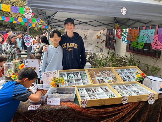 Connor Hsu (left) and Cole Cramer displaying insect specimens at Lorquin Scholars' event.