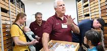 Jeff Smith (foreground), curator of the Bohart Museum of Entomology's global Lepidoptera, chats with guests. In back is Bohart associate Greg Kareofelas. (Photo by Kathy Keatley Garvey) for Bug Squad Blog