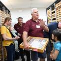 Jeff Smith (foreground), curator of the Bohart Museum of Entomology's global Lepidoptera, chats with guests. In back is Bohart associate Greg Kareofelas. (Photo by Kathy Keatley Garvey)