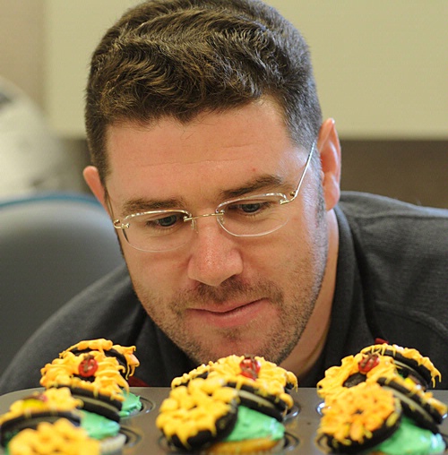 HMMMM--Randy Veirs of the UC Davis Department of Entomology, admires the ladybug cupcakes his wife made for the entomology office. (Photo by Kathy Keatley Garvey)