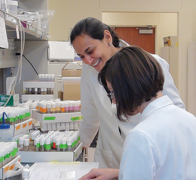 Molecular neurobiologist Anupama Dahanukar of UC Riverside working with  Drosophila cultures with junior specialist, Adriana Medina.