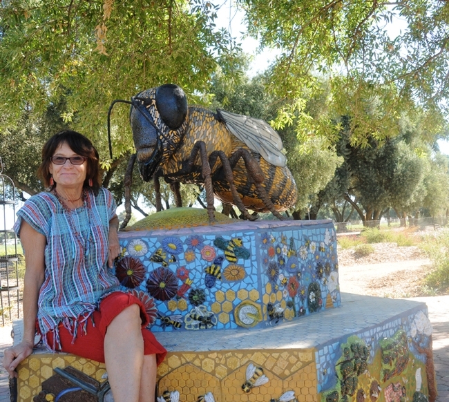 UC Davis Art/Science Fusion co-founder and co-director Donna Billick with her mosaic ceramic sculpture, Miss Bee Haven, in the half-acre Haagen-Dazs Honey Bee Haven on Bee Biology Road, UC Davis. (Photo by Kathy Keatley Garvey)