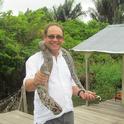Medical entomologist Anthony Cornel with a snake in Brazil.
