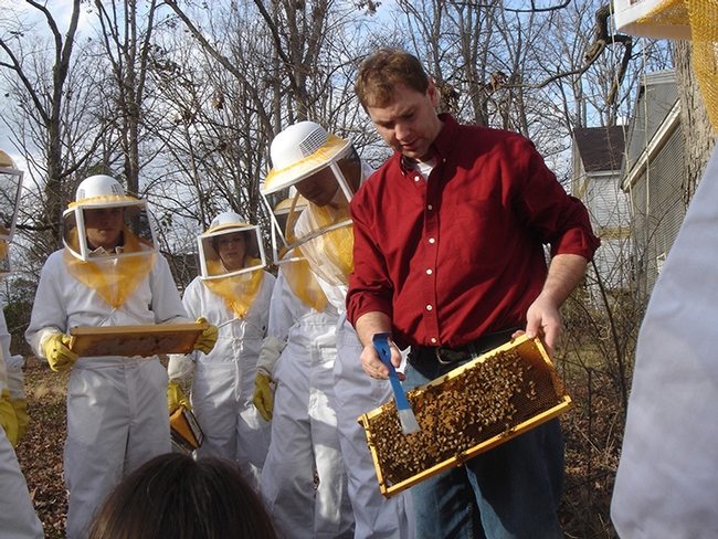 David Tarpy (in red), who received his doctorate in entomology from UC Davis, is a noted honey bee biologist and beekeeper. (Photo courtesy of David Tarpy)