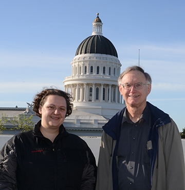 Extension apiculturist Elina Nino and Extension apiculturist (emeritus) Eric Mussen in front of the state capitol. (Photo by Kathy Keatley Garvey)