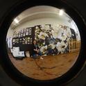 Fisheye view of the honey bee display at Madden Hall, Dixon May Fair. In front is Cammie Garton, fair employee. (Photo by Kathy Keatley Garvey)