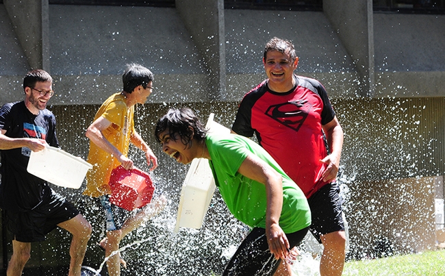 It was “fun in the sun” at the 13th annual Bruce Hammock Lab Water Balloon Battle. From left are Todd Harris and Sing Lee, assistant project scientists; graduate student Alifia Merchant who just received her master's degree in agriculture and environmental chemistry, and research scientist Christophe Morisseau, who coordinated the event. (Photo by Kathy Keatley Garvey)