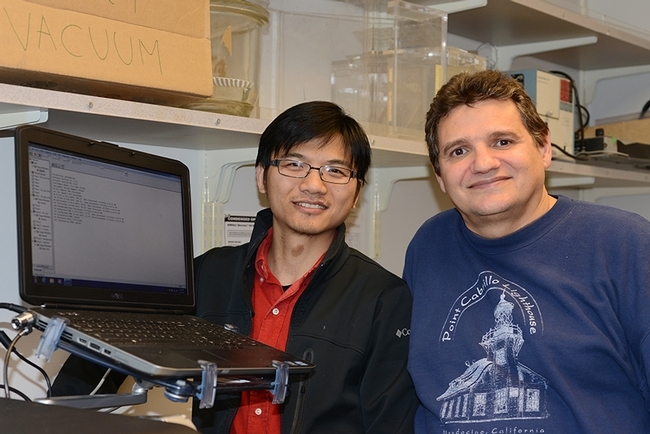 UC Davis researchers Jun Yang (left) and Christophe Morisseau of the Hammock lab. (Photo by Kathy Keatley Garvey)