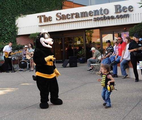 DANCING BEES--Scoopy, the Sacramento Bee's mascot (a bumble bee) dances with honey bee Olivia Gilmore, 3, at the 
