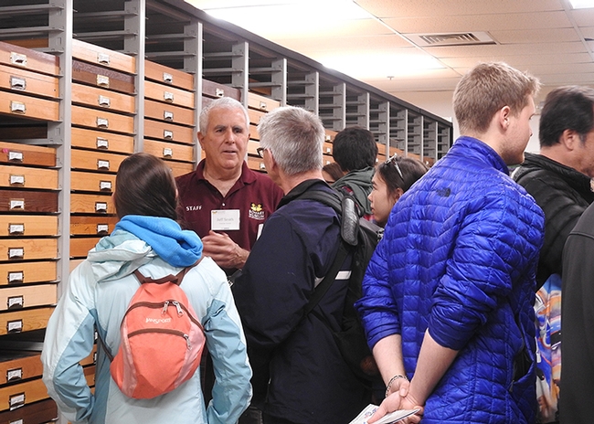 Entomologist Jeff Smith (center), who curates the butterfly and moth collections at the Bohart Museum of Entomology, answers questions.(Photo by Kathy Keatley Garvey)