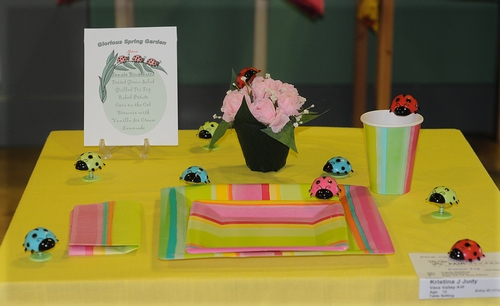CREATIVE table setting by Kristina Judy of the Vaca Valley 4-H Club is dotted with ladybugs. The table setting is on display June 23-27 in McCormack Hall at the Solano County Fair, Vallejo. (Photo by Kathy Keatley Garvey)