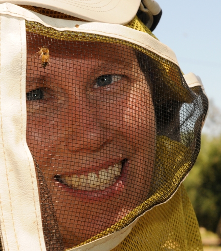 With a bee on her veil, camp coordinator Tabatha Yang is shown here in a 2011 photo at the Harry H. Laidlaw Jr. Honey Bee Research Facility. (Photo by Kathy Keatley Garvey)